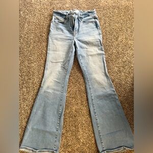 Good American. Size 2/26. Light wash denim wide flare jeans.